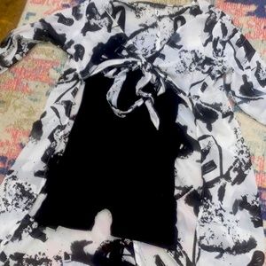 Cute black romper super soft and stretch paired with a really cute cardigan